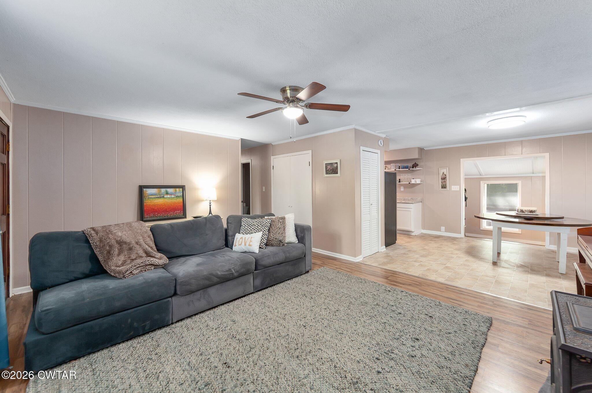101 Wilde Road Pinson, TN 38366 - Photo 2 of 16 a living room with furniture and a wooden floor