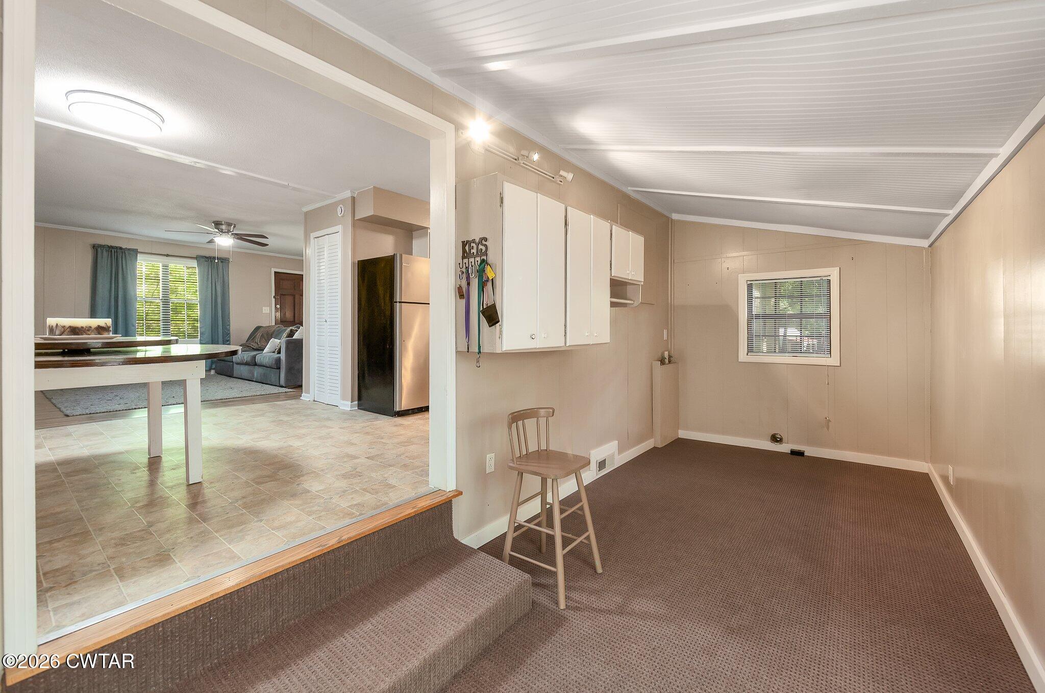 101 Wilde Road Pinson, TN 38366 - Photo 5 of 16 an empty room with a cabinet and mirrors