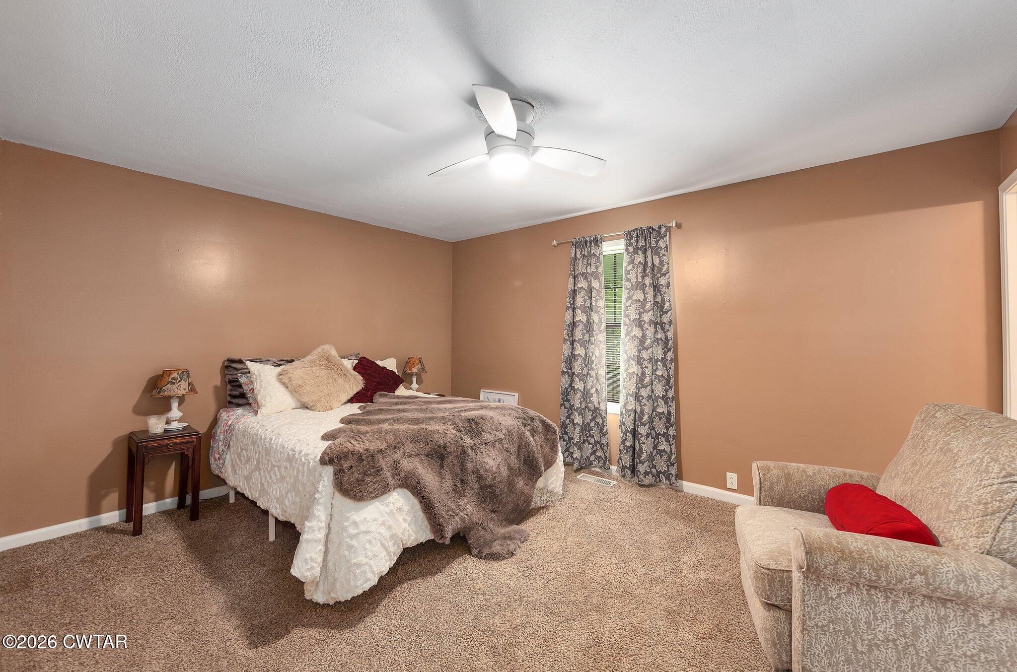 101 Wilde Road Pinson, TN 38366 - Photo 8 of 16 a bed room with a bed and a window