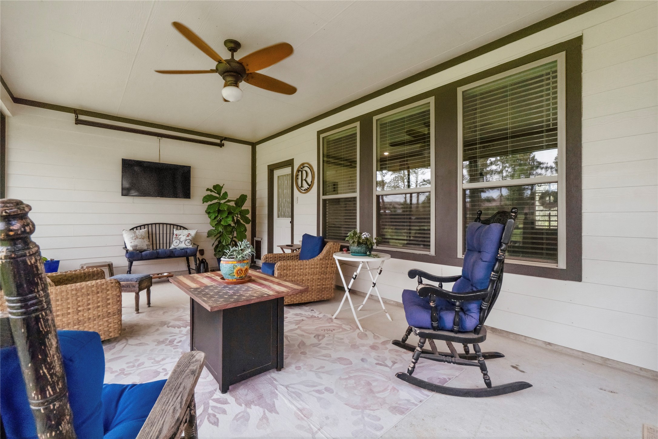 13447 Maverick Trail Road Conroe, TX 77303 - Photo 29 of 48 This screened-in porch is the perfect place to start slow mornings or unwind at sunset, offering peaceful backyard views and a comfortable space to relax year-round.