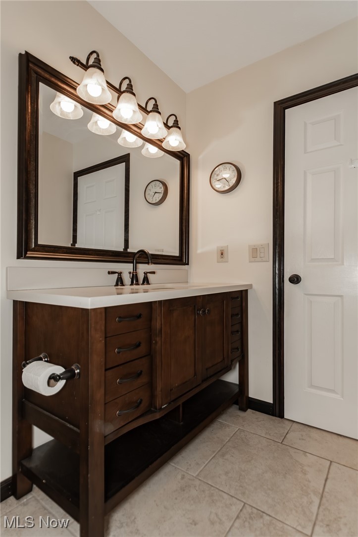 4815 South Ridge Road Perry, OH 44081 - Photo 29 of 48 Bathroom with vanity and light tile patterned flooring