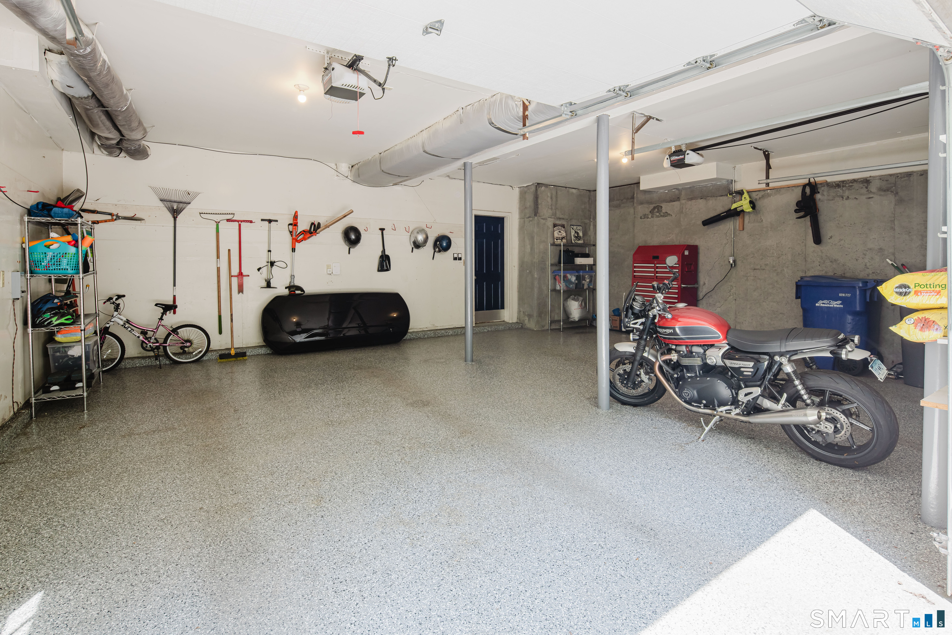 3 Partridge Trail Sherman, CT 06784 - Photo 37 of 37 a view of a garage with a bike and a car