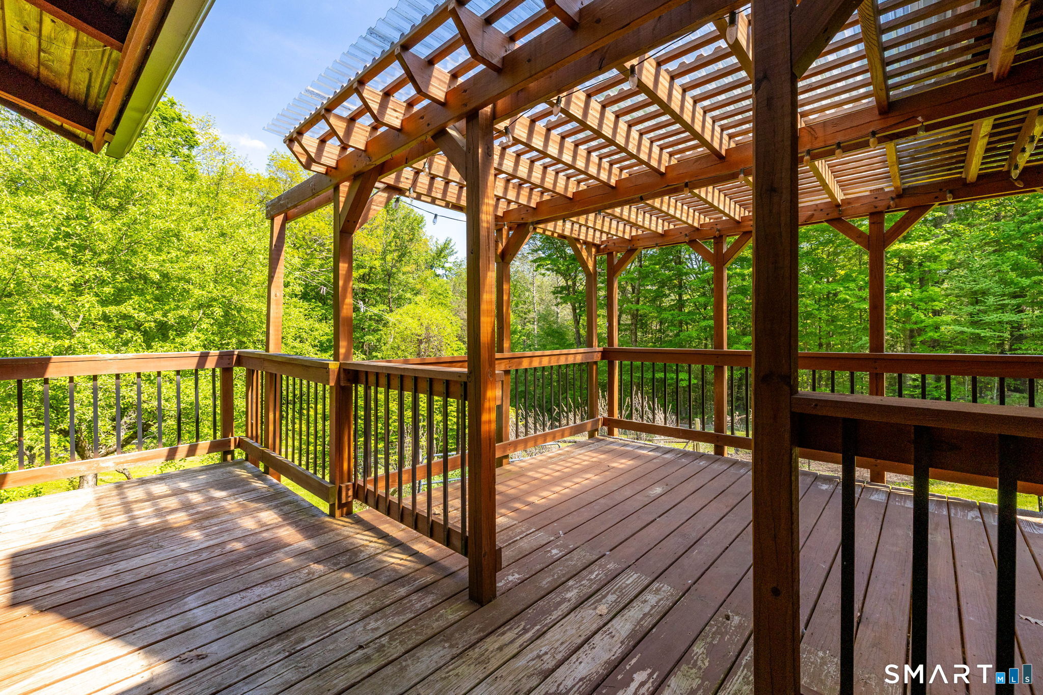 250 Center Hill Road Barkhamsted, CT 06063 - Photo 26 of 40 a view of a wooden deck with a yard
