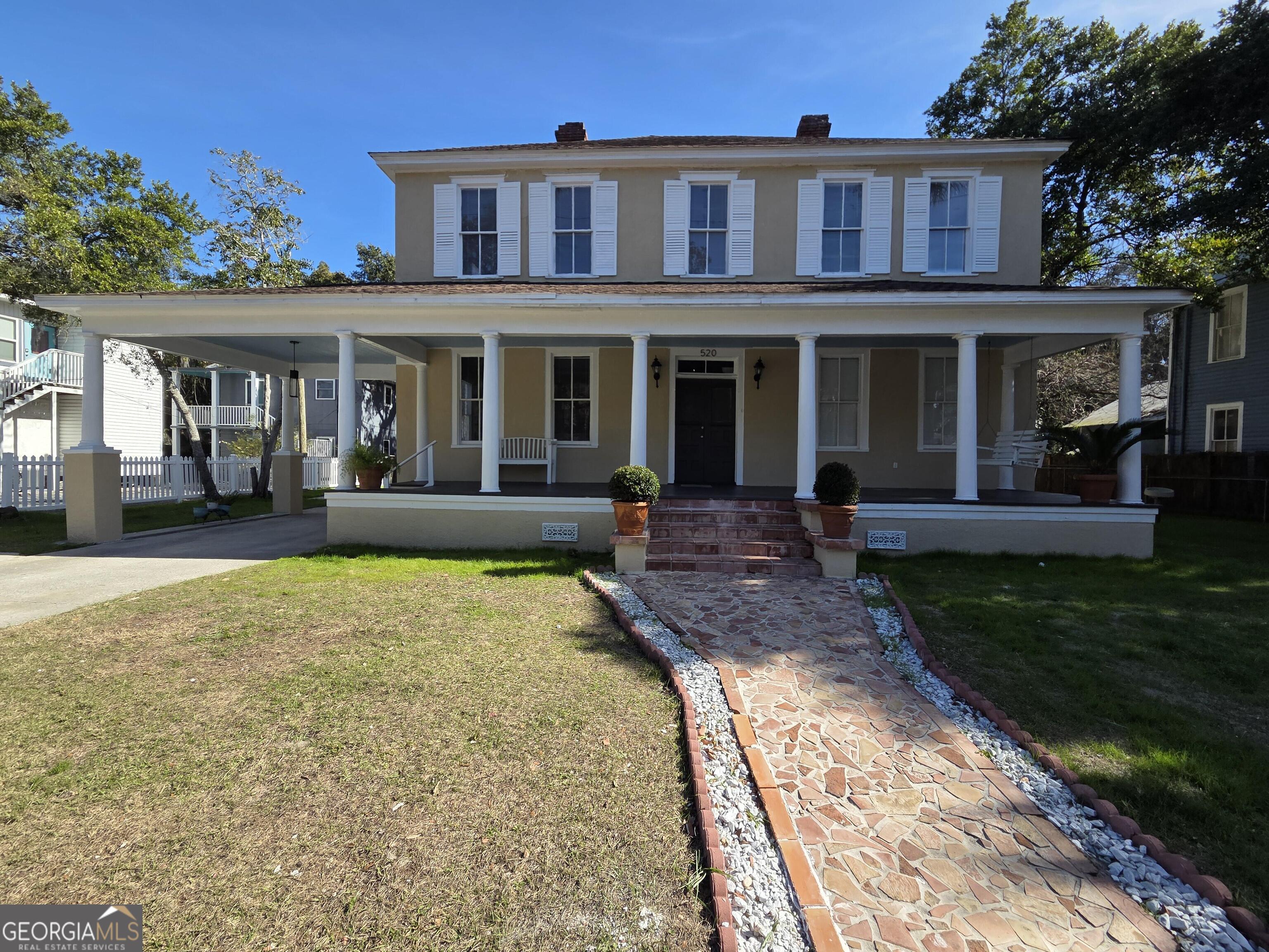 a house view with a garden space