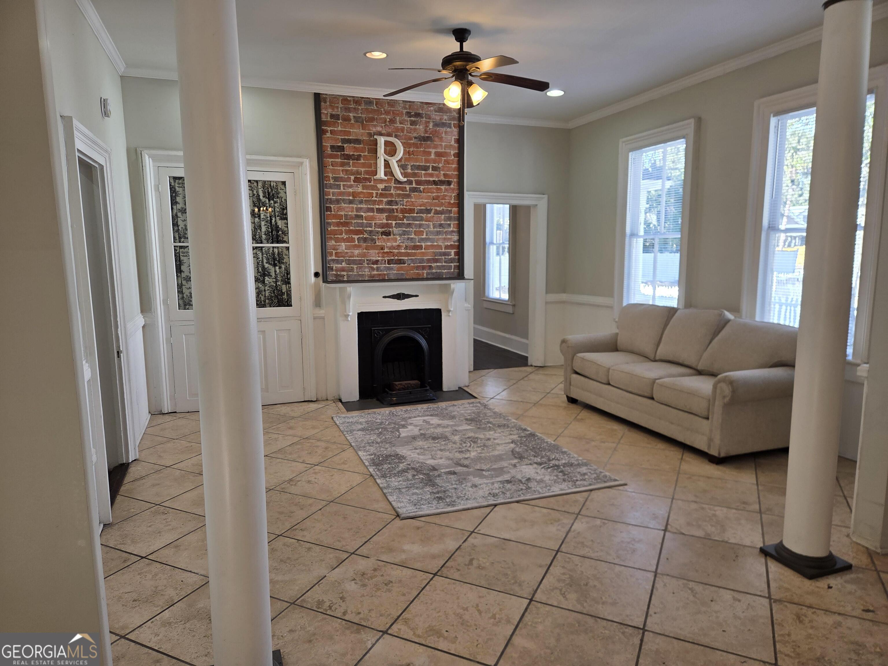 520 Ellis Street Brunswick, GA 31520 - Photo 13 of 48 a living room with furniture and a fireplace