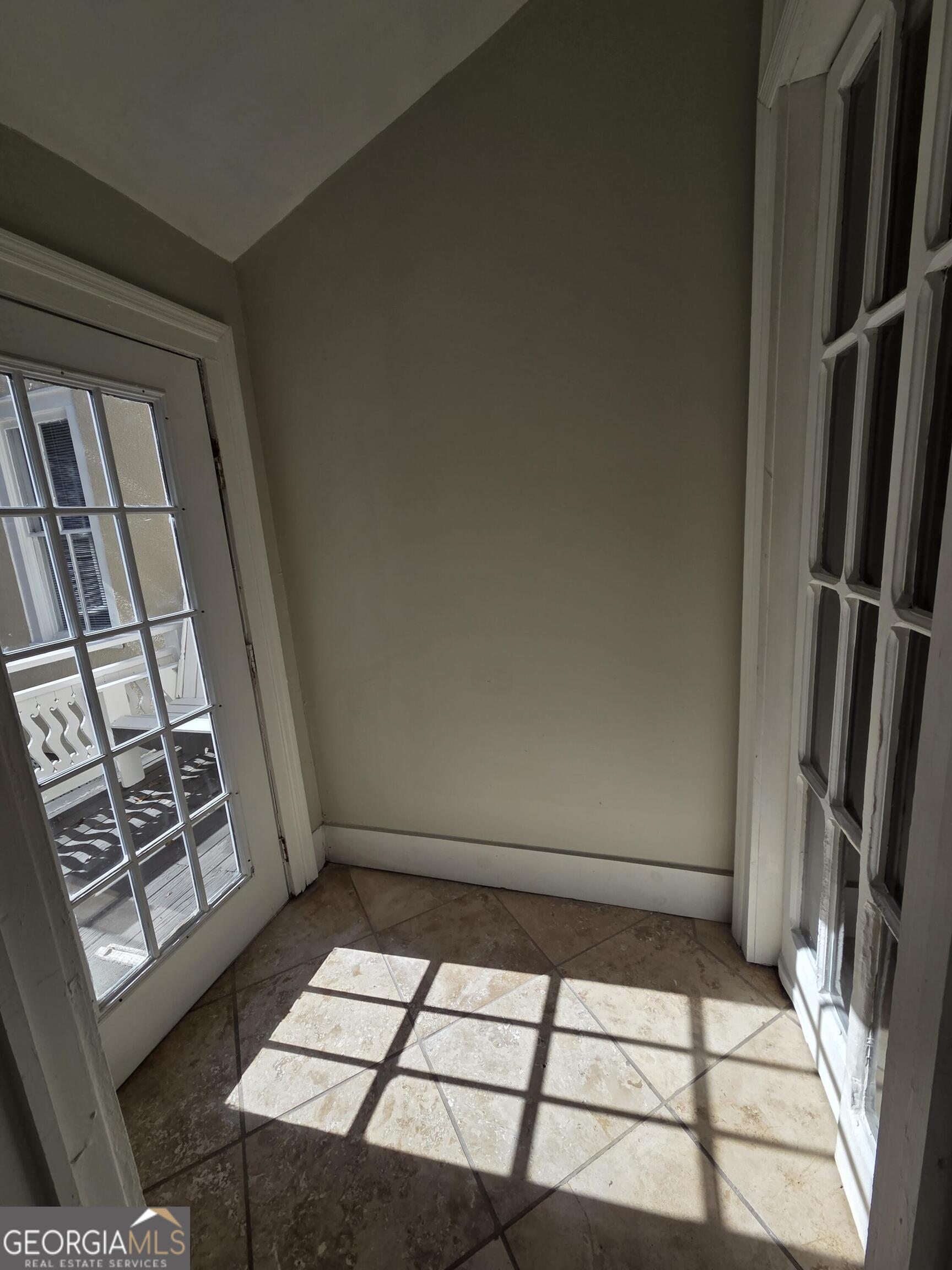 520 Ellis Street Brunswick, GA 31520 - Photo 16 of 48 a view of staircase with white walls