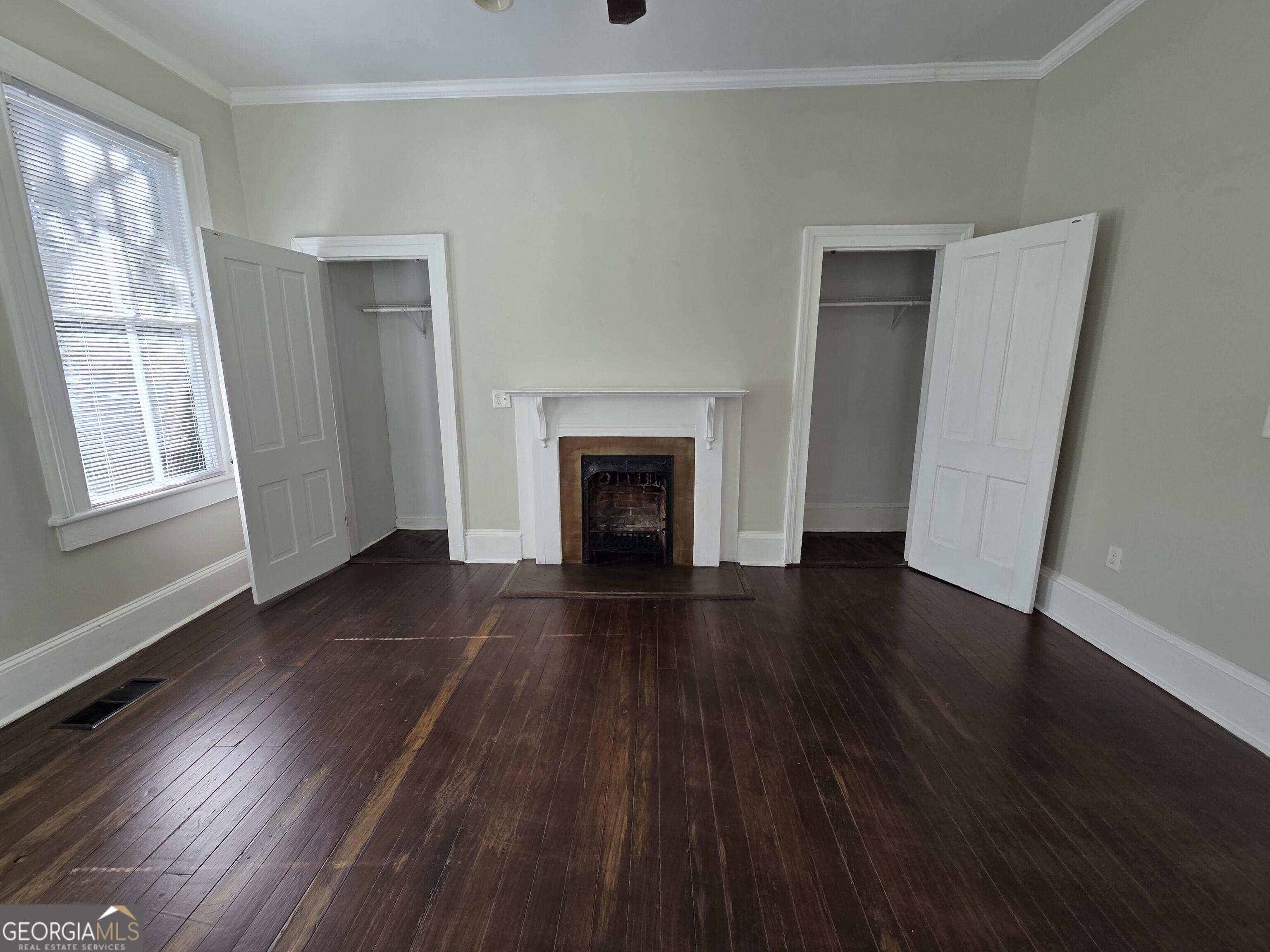 520 Ellis Street Brunswick, GA 31520 - Photo 23 of 48 wooden floor fireplace and natural light in room
