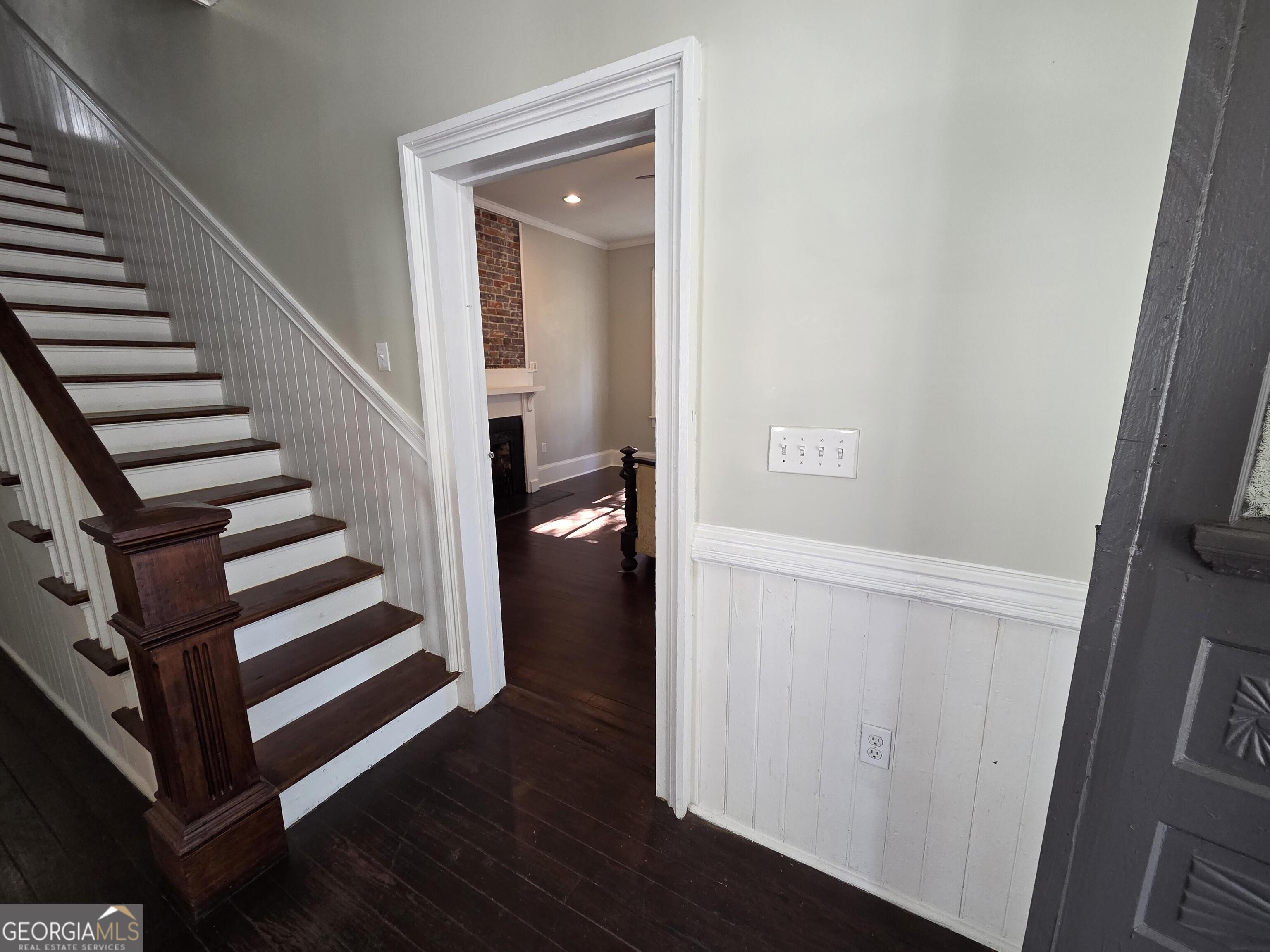 520 Ellis Street Brunswick, GA 31520 - Photo 24 of 48 a view of a hallway with wooden floor and staircase