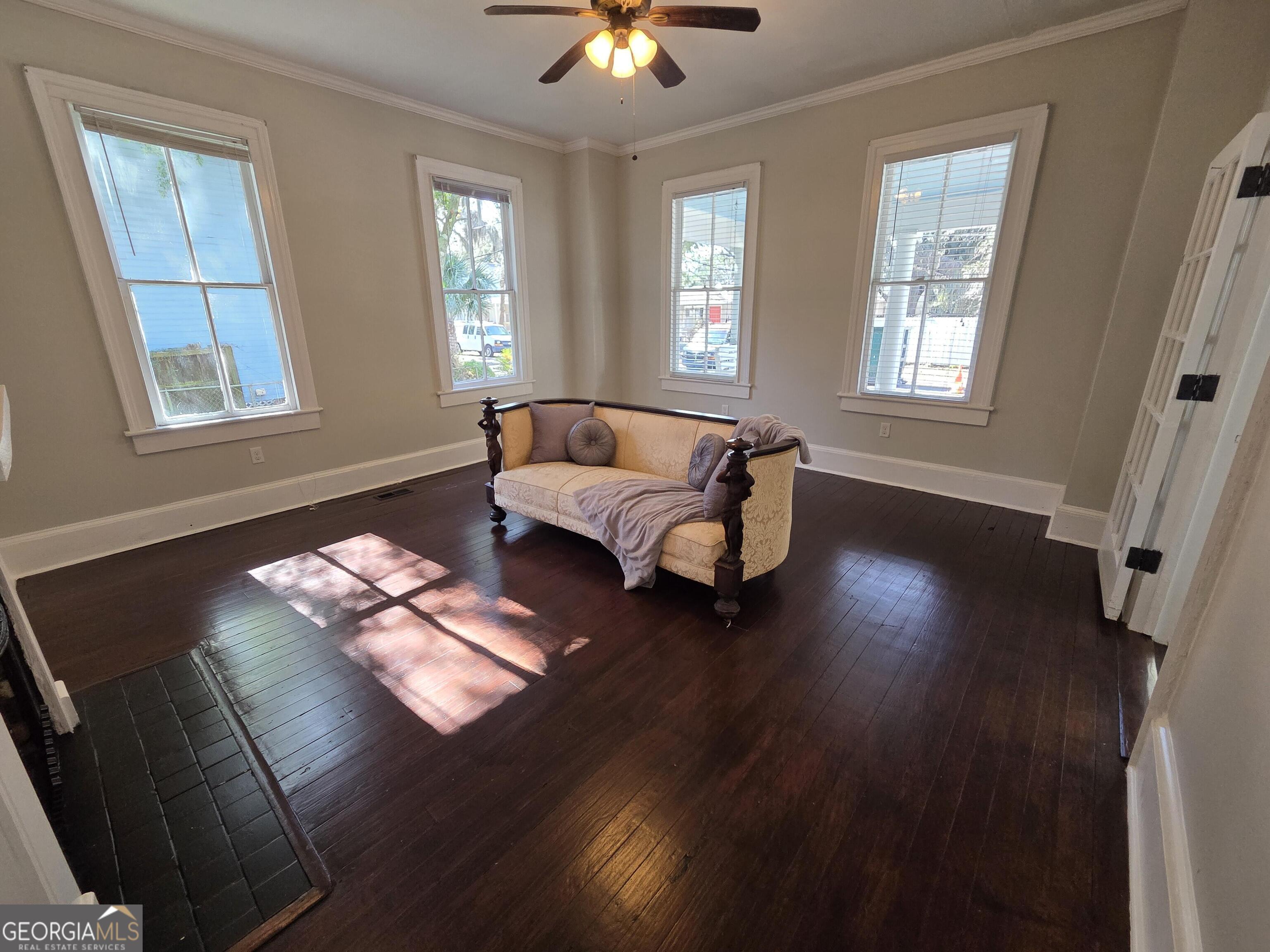 520 Ellis Street Brunswick, GA 31520 - Photo 26 of 48 a living room with furniture and a window
