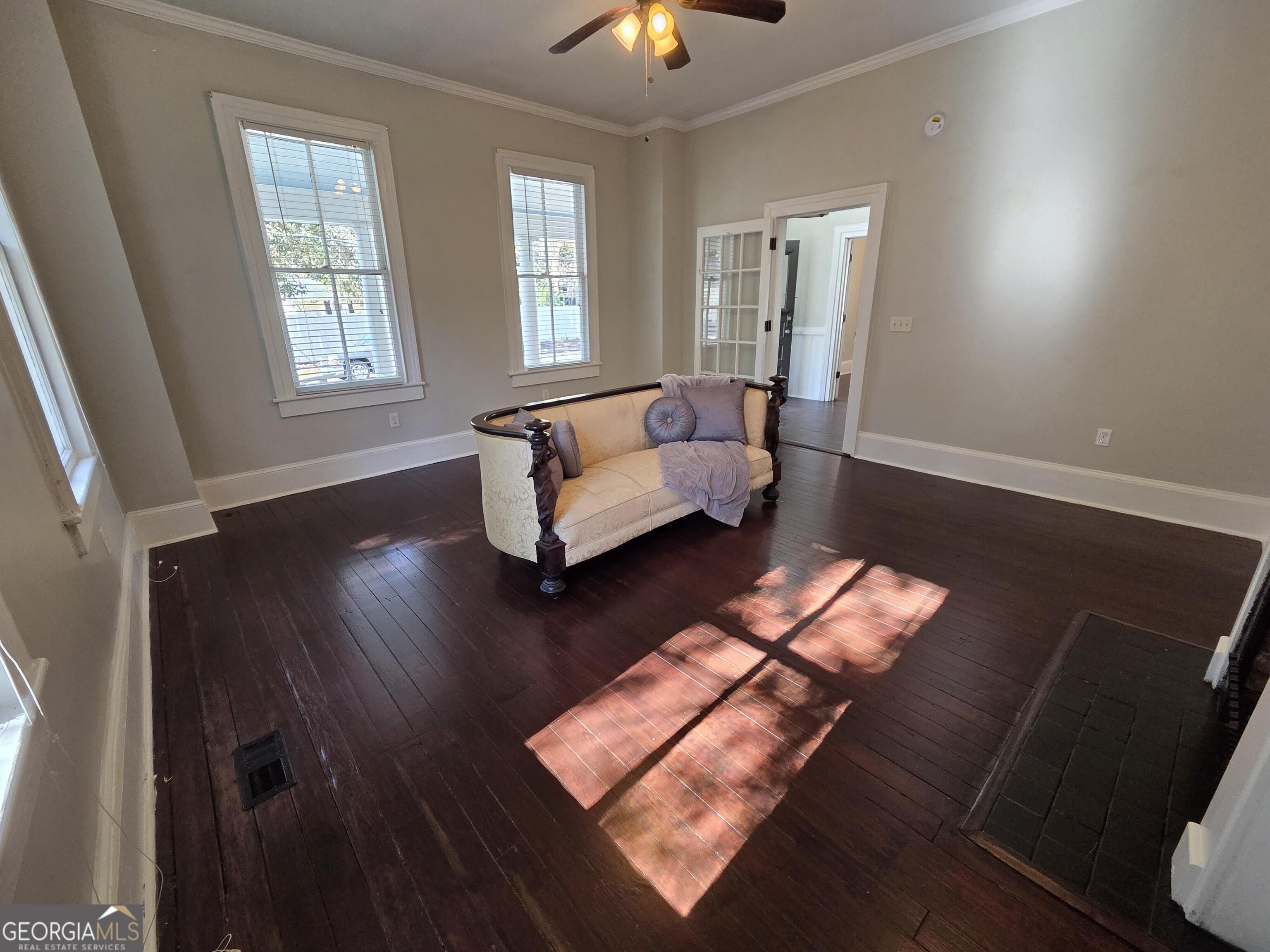 520 Ellis Street Brunswick, GA 31520 - Photo 27 of 48 a living room with furniture and a chandelier