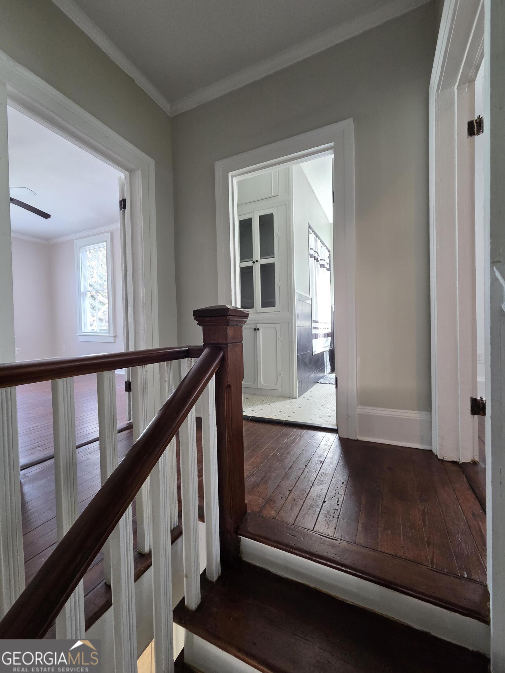 520 Ellis Street Brunswick, GA 31520 - Photo 29 of 48 a view of an entryway with wooden floor and stairs