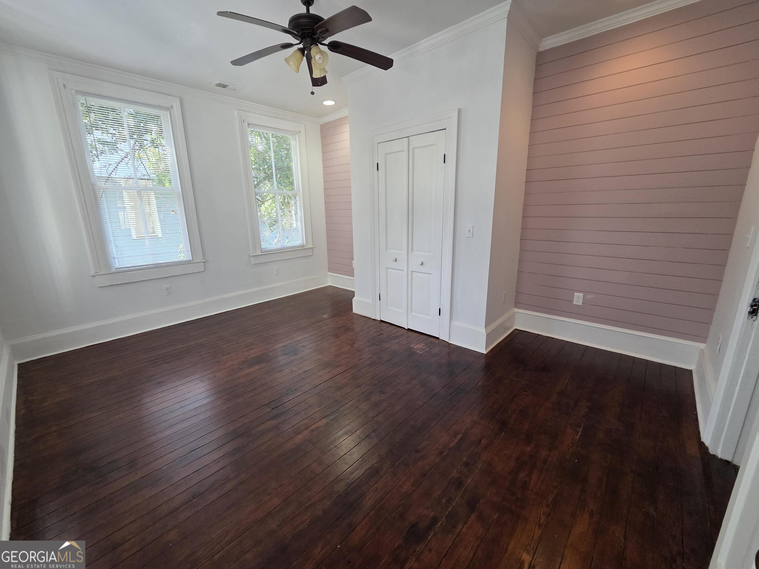 520 Ellis Street Brunswick, GA 31520 - Photo 30 of 48 a view of an empty room with wooden floor and a window