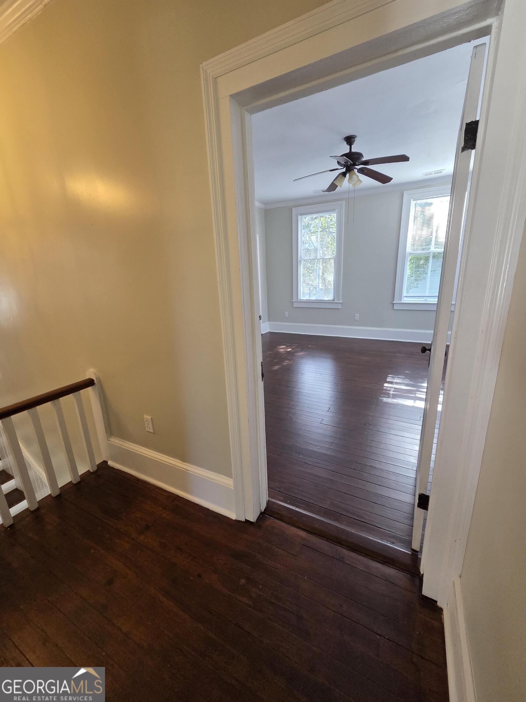 520 Ellis Street Brunswick, GA 31520 - Photo 39 of 48 a view of an empty room and wooden floor