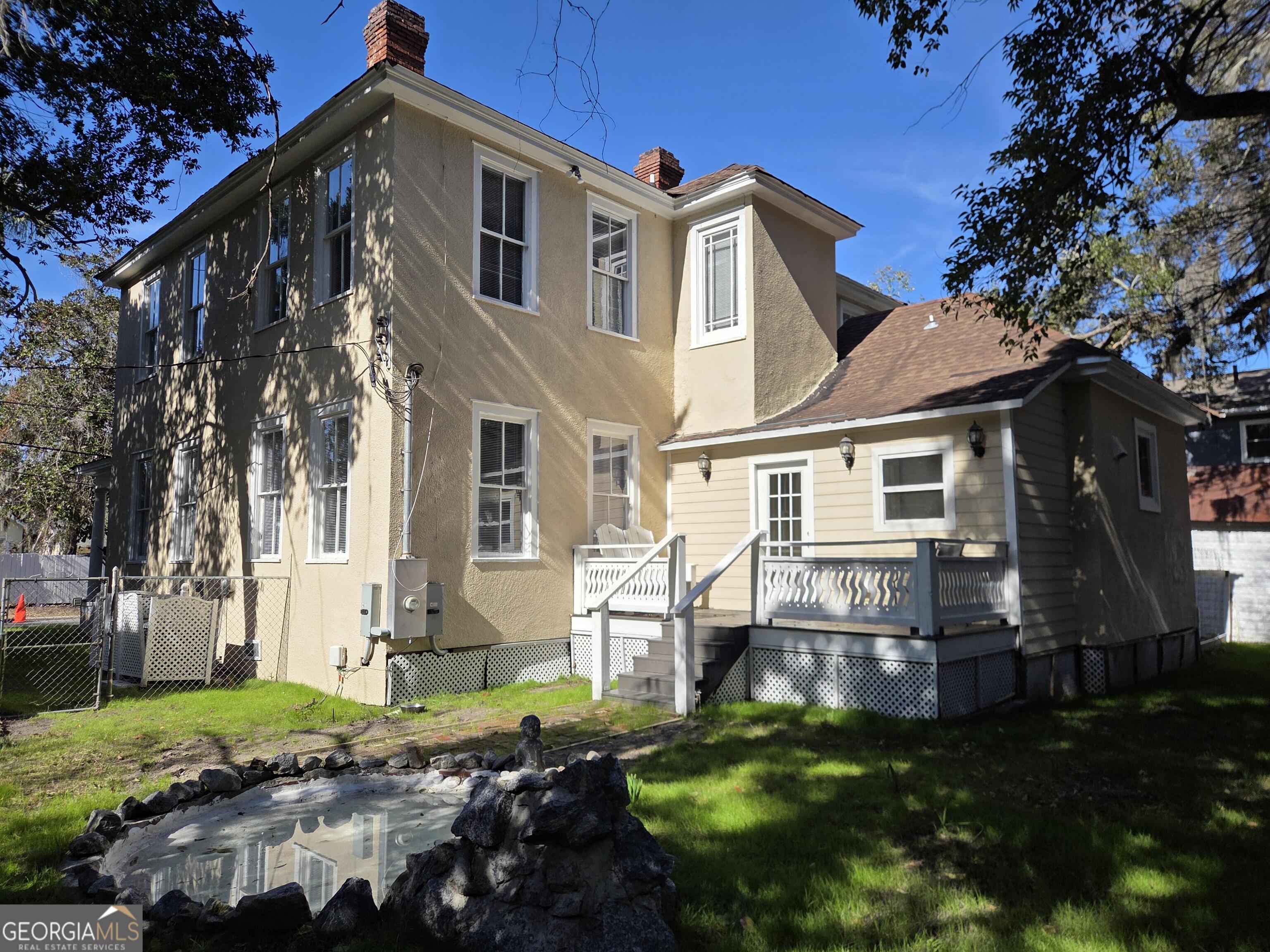520 Ellis Street Brunswick, GA 31520 - Photo 4 of 48 a front view of a house with garden