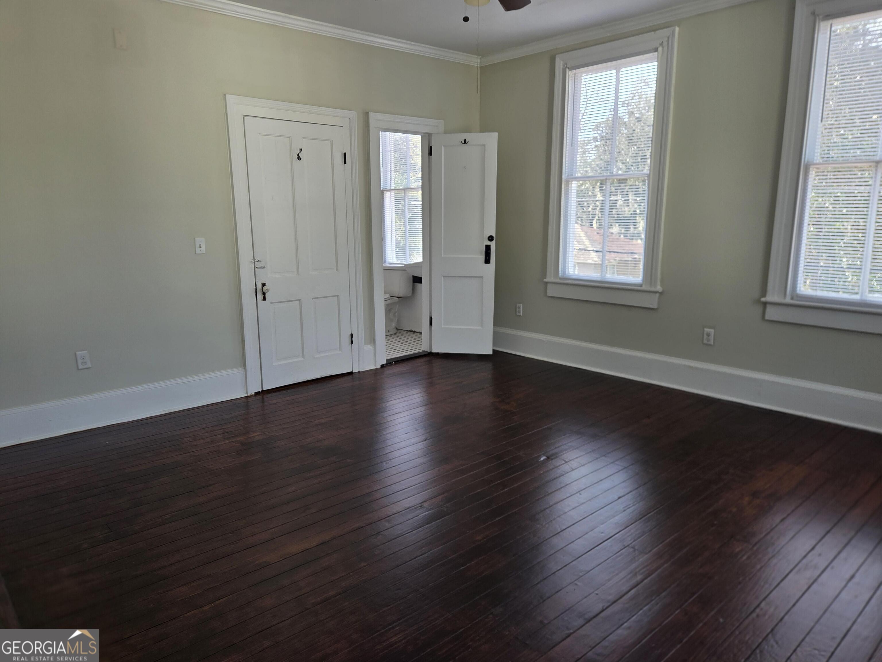 520 Ellis Street Brunswick, GA 31520 - Photo 46 of 48 an empty room with wooden floor and windows
