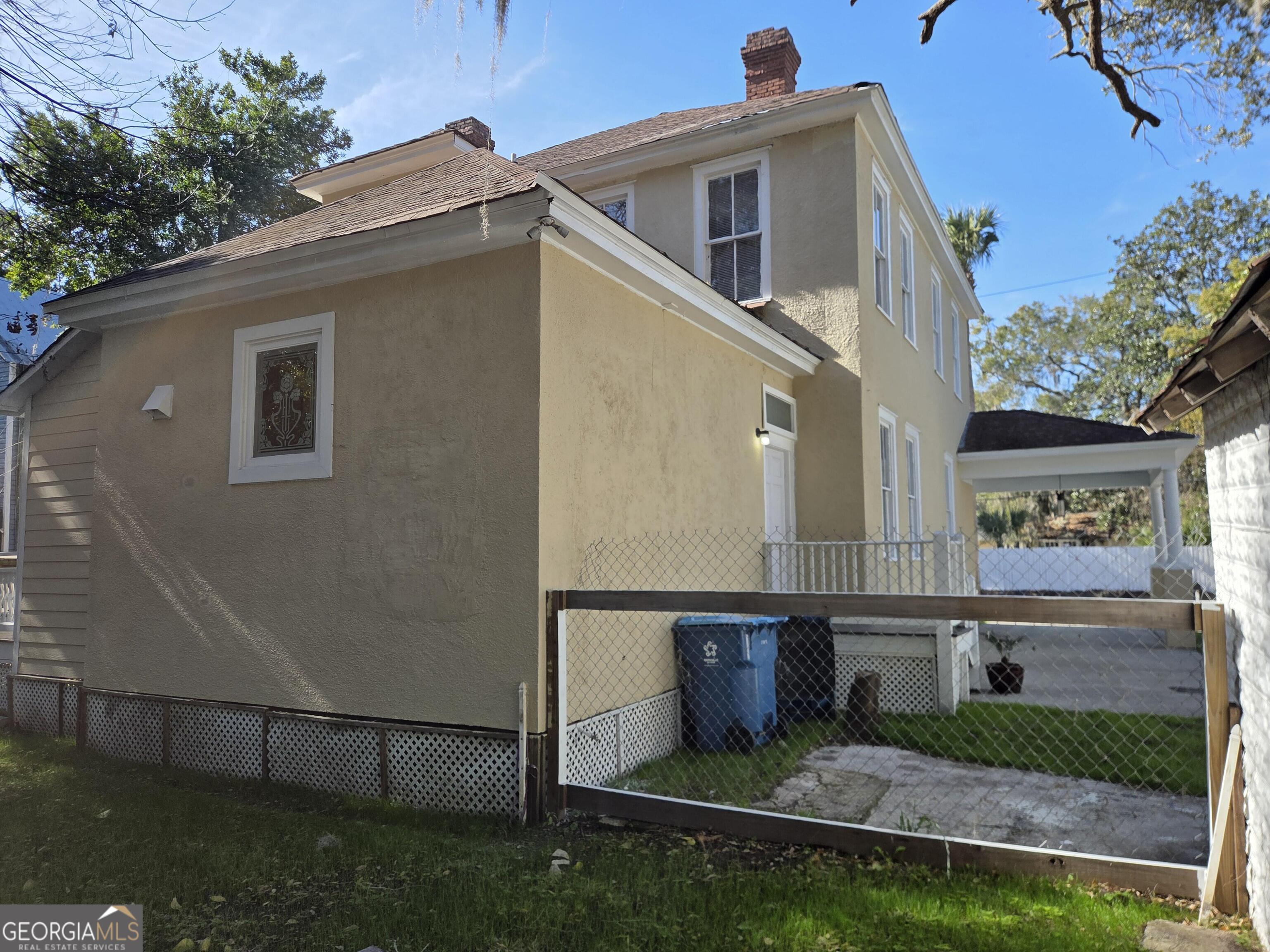 520 Ellis Street Brunswick, GA 31520 - Photo 5 of 48 a view of a house with a yard
