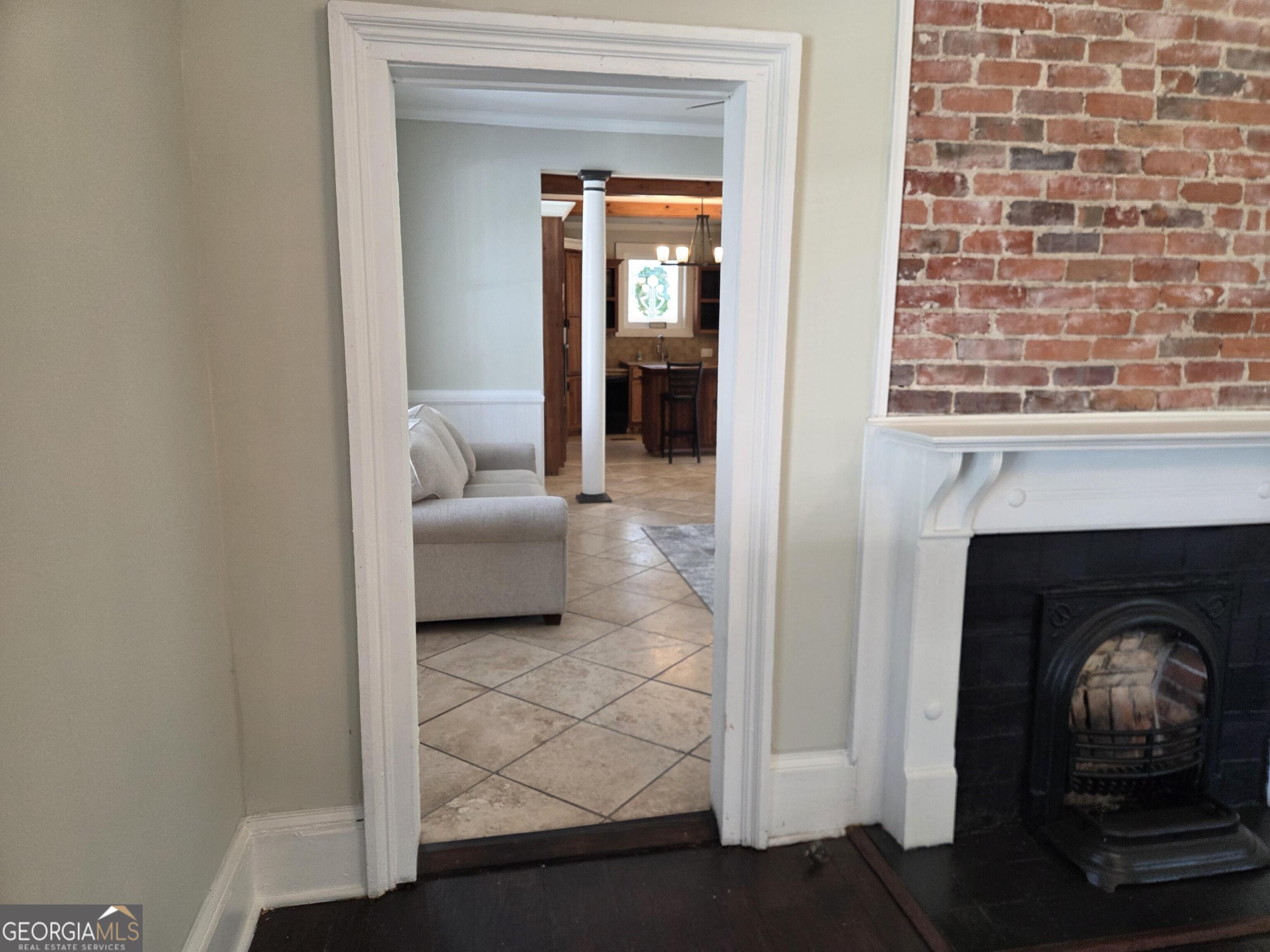 520 Ellis Street Brunswick, GA 31520 - Photo 10 of 48 a living room with furniture and a fireplace