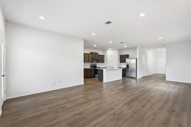 a view of kitchen with wooden floor