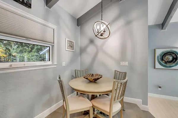 a kitchen with granite countertop stainless steel appliances and wooden cabinets