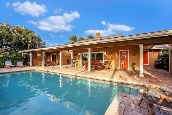 a view of swimming pool with chairs