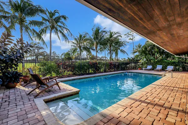 a lobby with furniture and floor to ceiling window