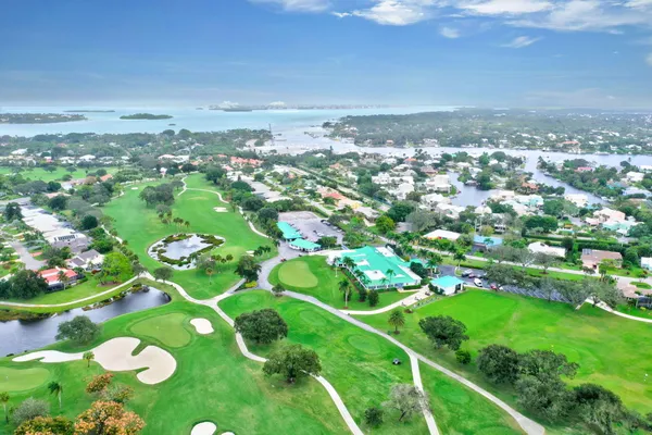 an aerial view of a house with a garden