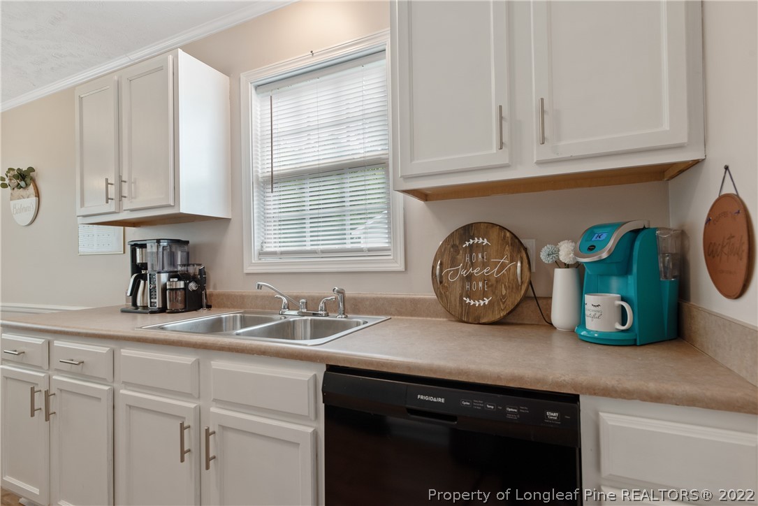 191 Quarry Lane Raeford, NC 28376 - Photo 18 of 42 a kitchen with sink and a stove