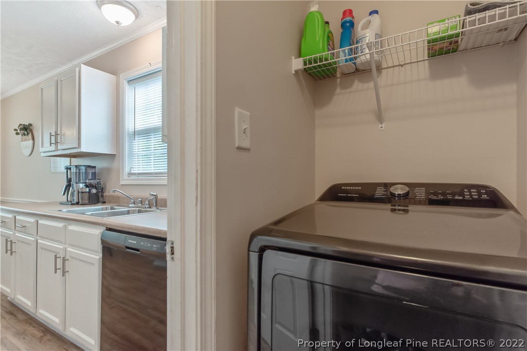 191 Quarry Lane Raeford, NC 28376 - Photo 19 of 42 a view of a kitchen stove a sink dishwasher and a refrigerator