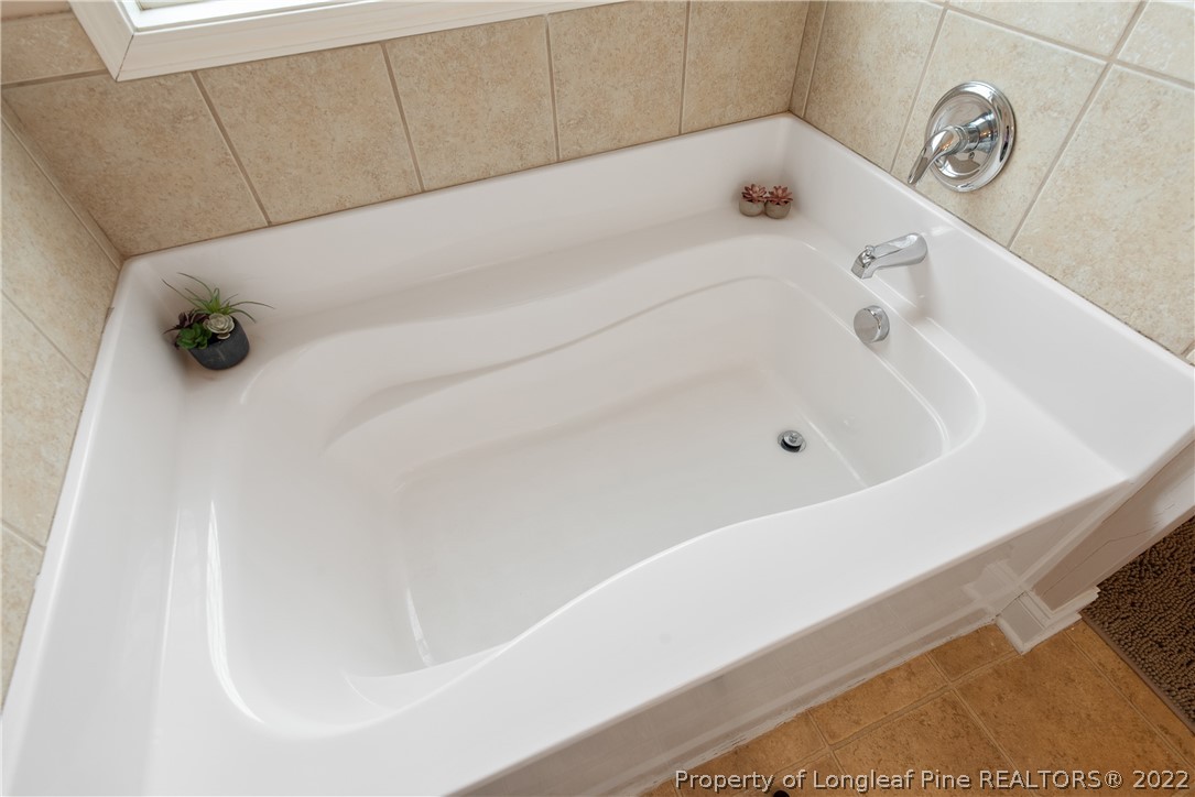 191 Quarry Lane Raeford, NC 28376 - Photo 28 of 42 a bathroom with a bathtub