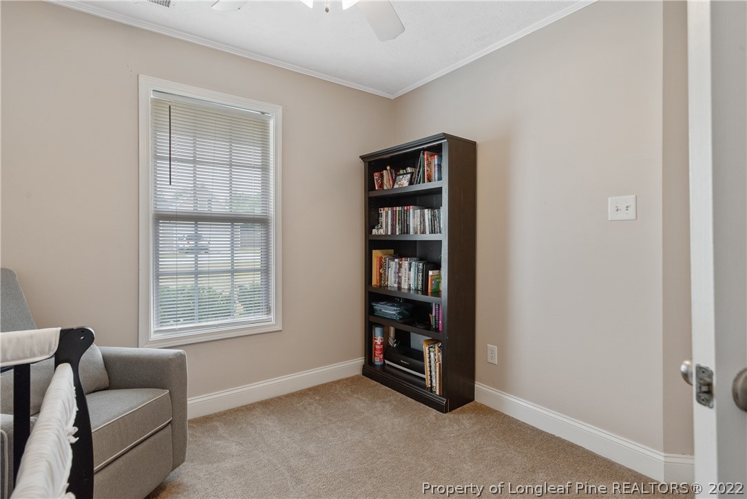 191 Quarry Lane Raeford, NC 28376 - Photo 30 of 42 a livingroom with a couch and a window