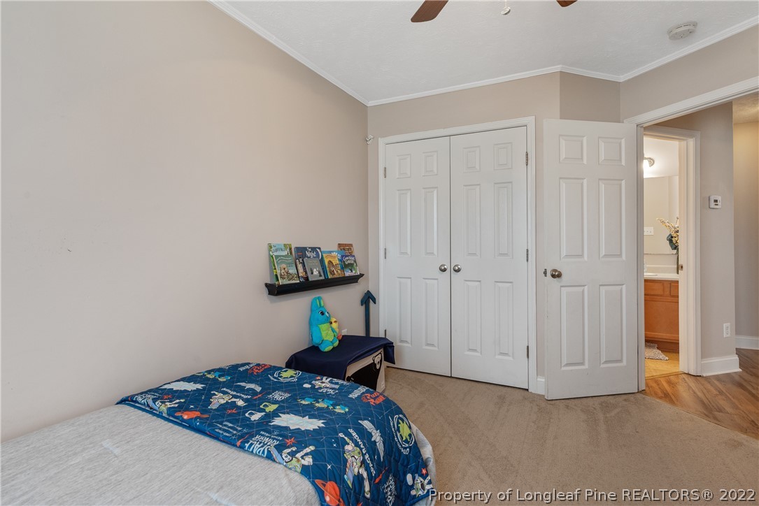 191 Quarry Lane Raeford, NC 28376 - Photo 34 of 42 a bedroom with a bed and a cabinets