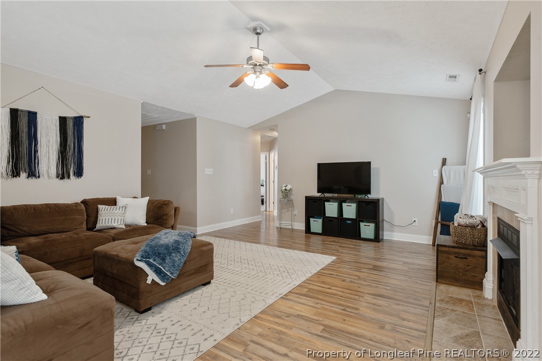 191 Quarry Lane Raeford, NC 28376 - Photo 9 of 42 a living room with furniture and a flat screen tv