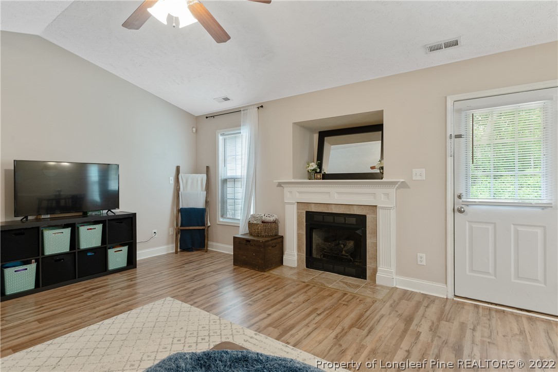 191 Quarry Lane Raeford, NC 28376 - Photo 10 of 42 a living room with furniture and a flat screen tv