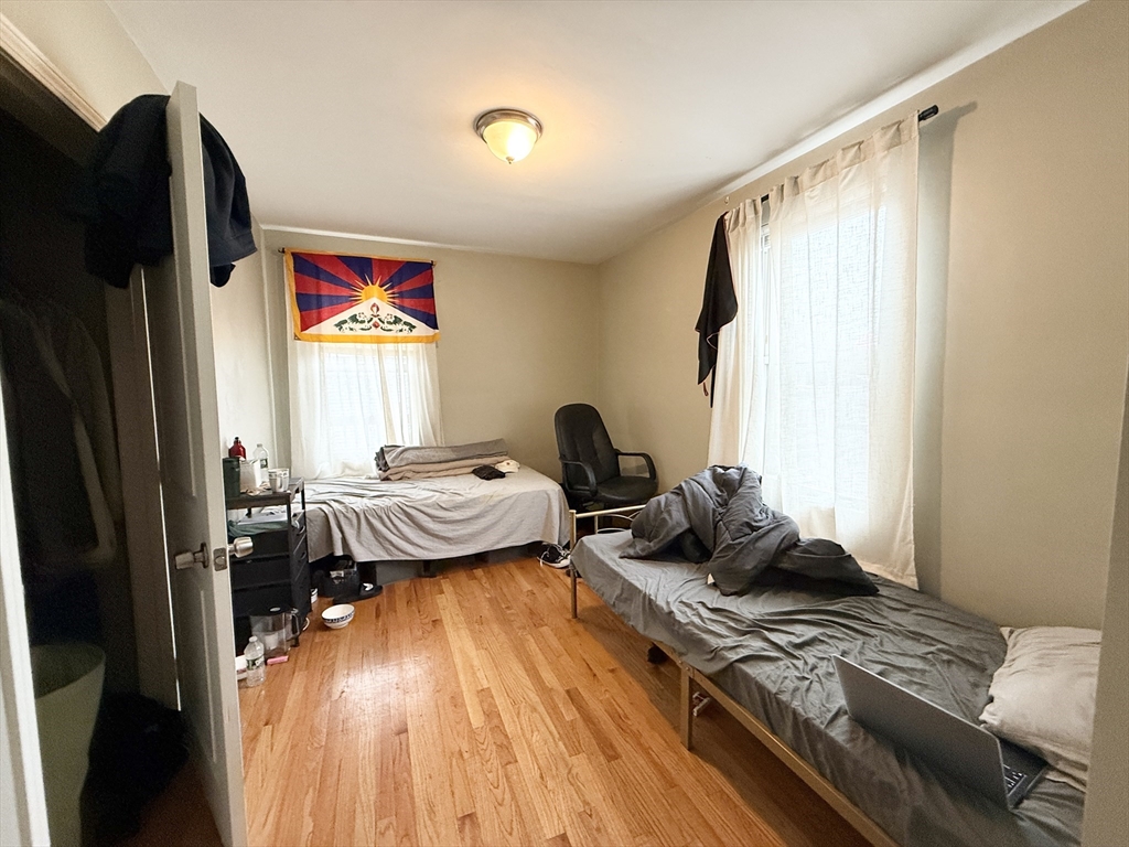 3977 Washington Street, Unit 3 Boston, MA 02131 - Photo 3 of 11 a living room with furniture and a window