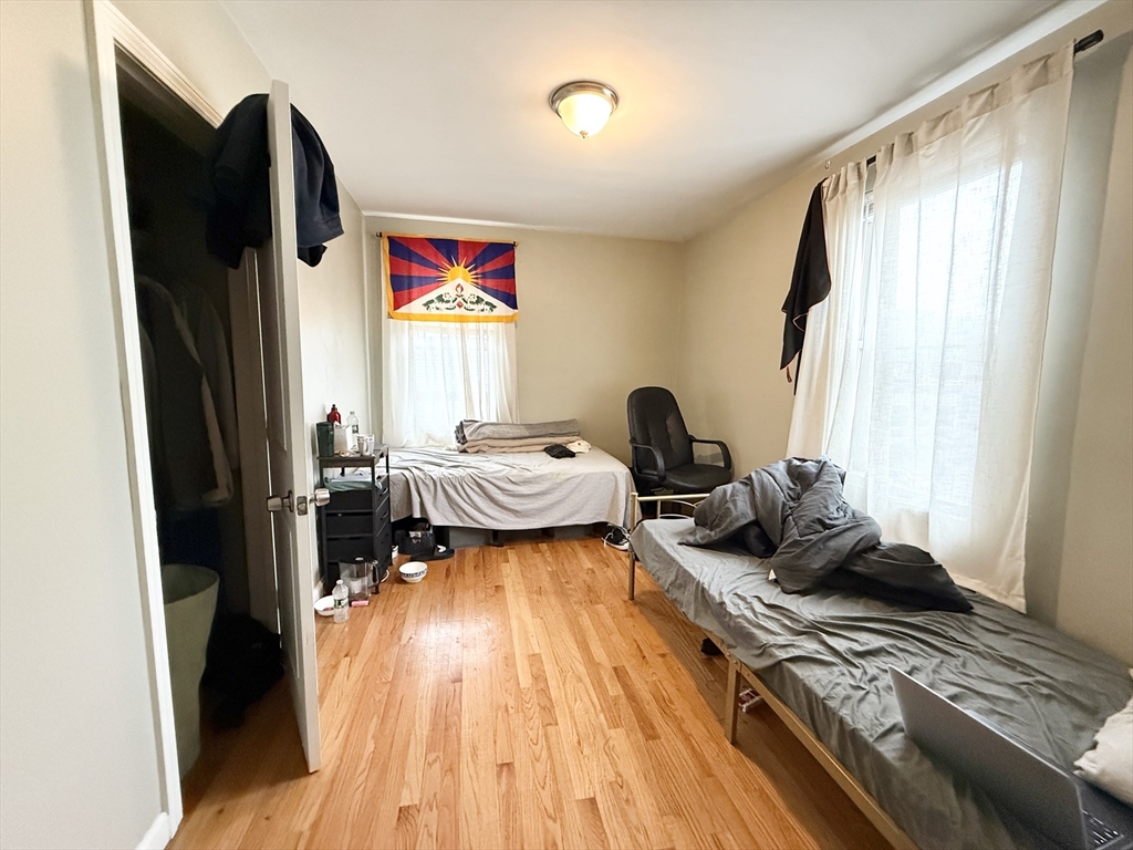 3977 Washington Street, Unit 3 Boston, MA 02131 - Photo 4 of 11 a bed room with a bed and a window