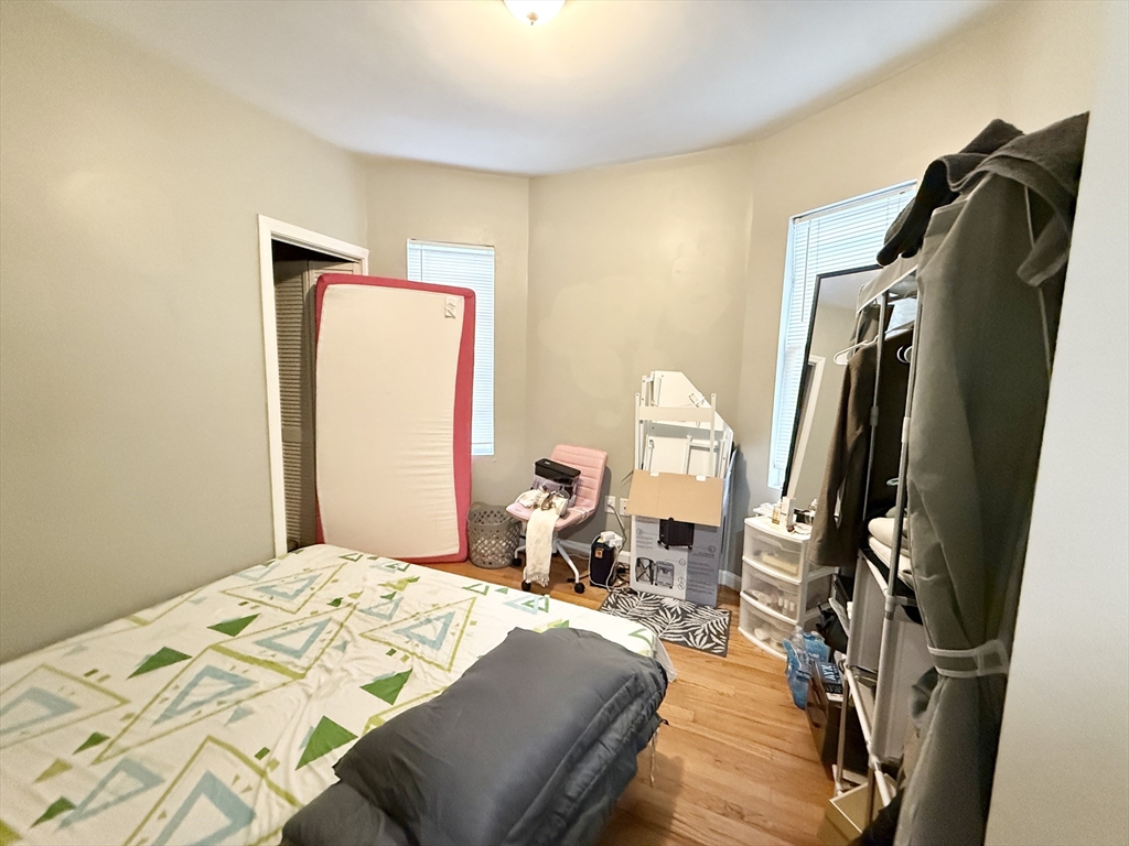 3977 Washington Street, Unit 3 Boston, MA 02131 - Photo 10 of 11 a bedroom with a bed and dresser