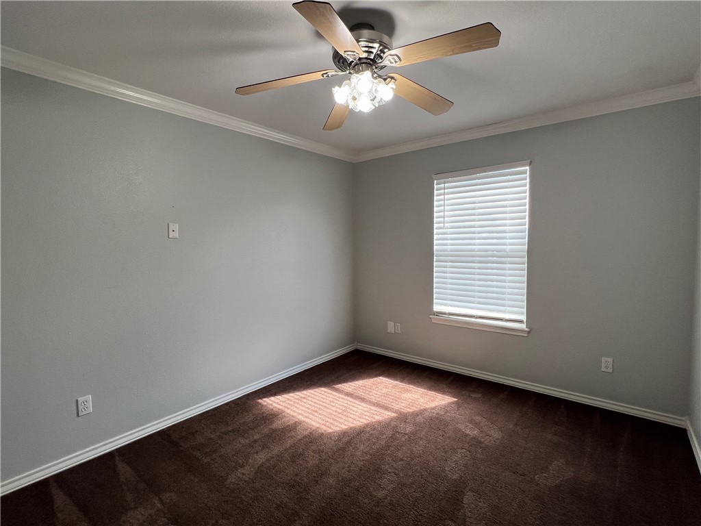 5026 Yorktown Boulevard, Unit 23 Corpus Christi, TX 78413 - Photo 13 of 29 an empty room with a window and a fan