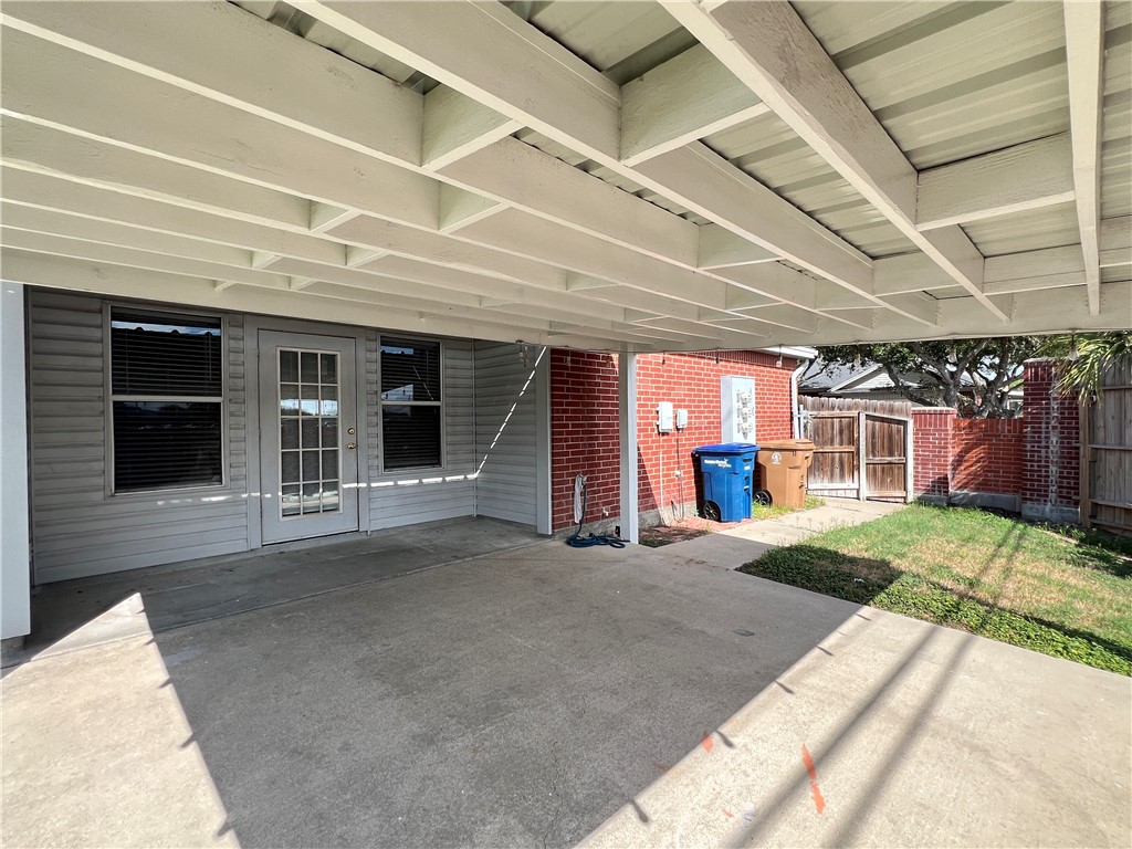 5026 Yorktown Boulevard, Unit 23 Corpus Christi, TX 78413 - Photo 24 of 29 a view of a house with a patio