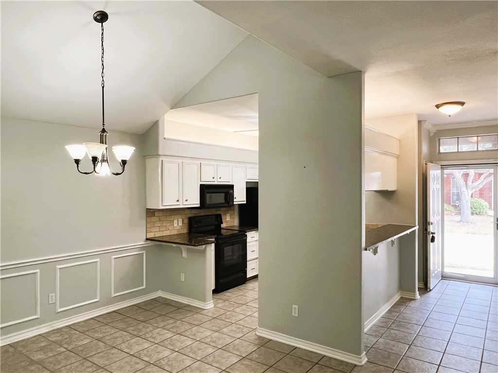 5026 Yorktown Boulevard, Unit 23 Corpus Christi, TX 78413 - Photo 3 of 29 a kitchen with stainless steel appliances granite countertop a refrigerator and a sink