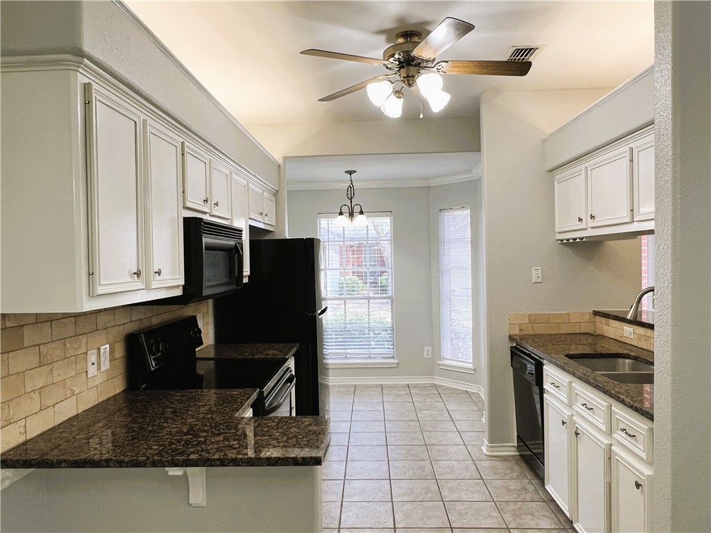 5026 Yorktown Boulevard, Unit 23 Corpus Christi, TX 78413 - Photo 4 of 29 a kitchen with stainless steel appliances granite countertop a sink stove and refrigerator