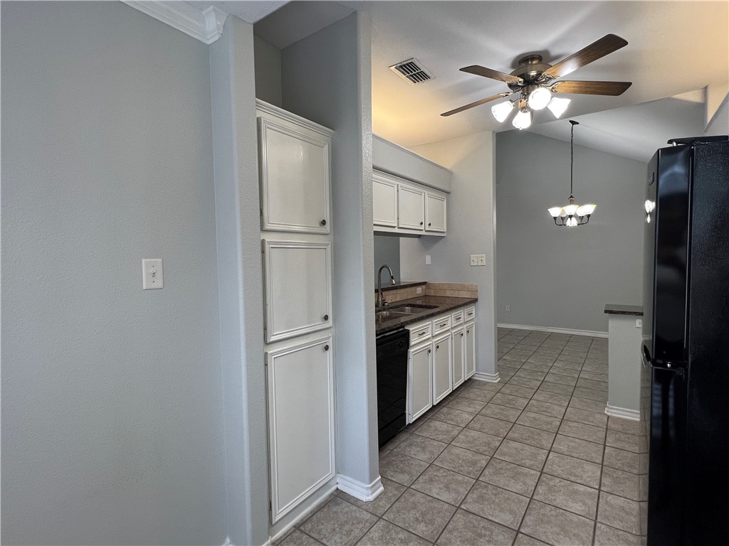 5026 Yorktown Boulevard, Unit 23 Corpus Christi, TX 78413 - Photo 8 of 29 a kitchen with stainless steel appliances a refrigerator and a stove top oven