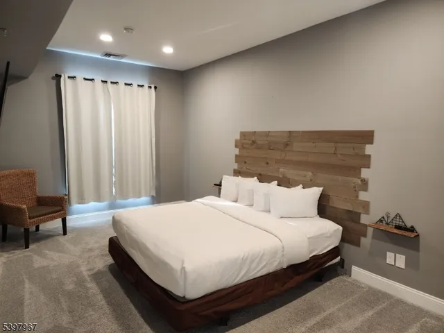 a bedroom with a bed and cabinets