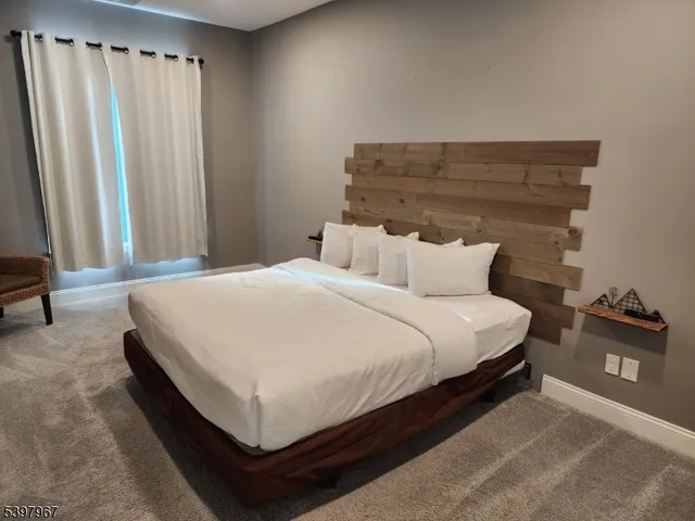 a bedroom with a bed and walk in closet