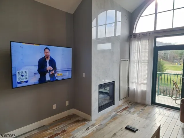 wooden floor in an empty room with a fireplace