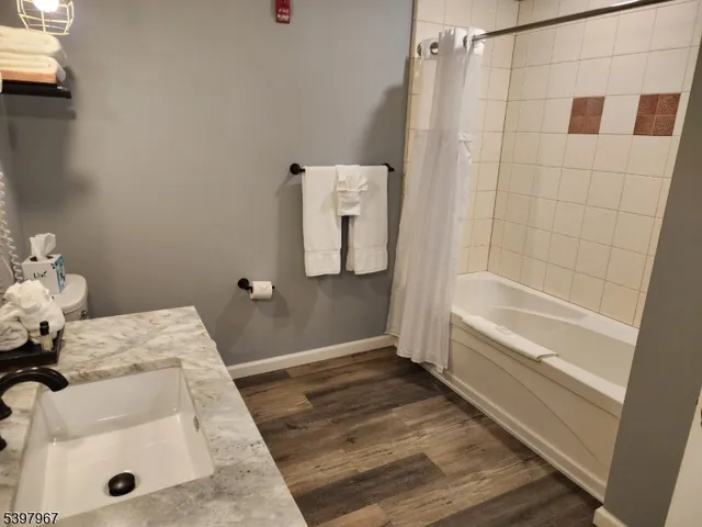 a bathroom with a tub and shower