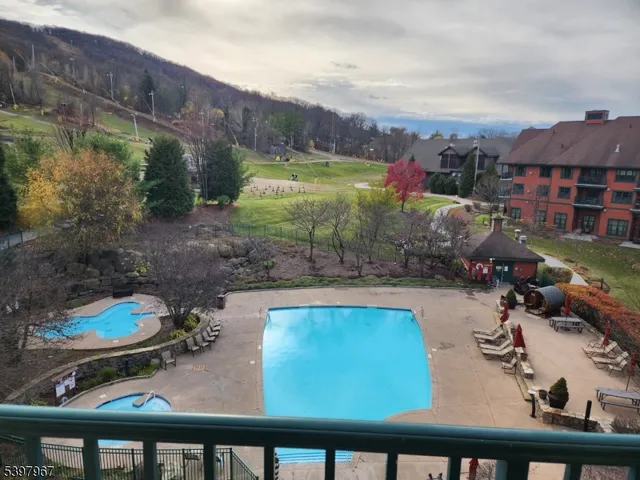 a view of a chairs and table in patio