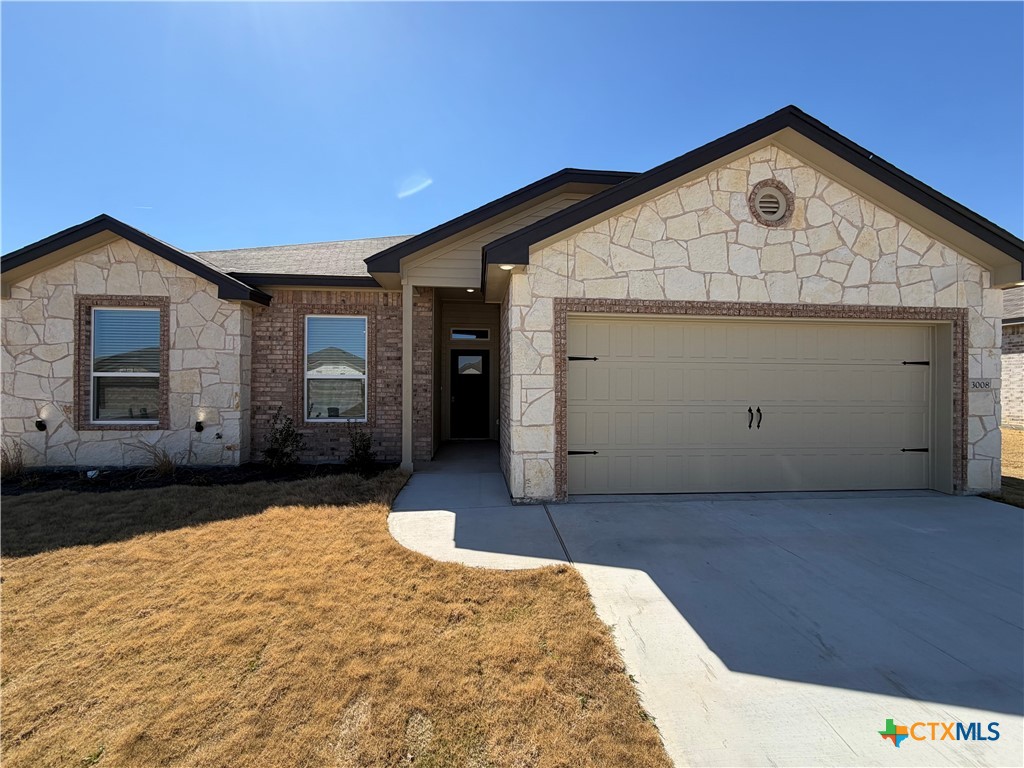 3008 Seeker Street Killeen, TX 76549 - Photo 1 of 25 a front view of a house with a yard