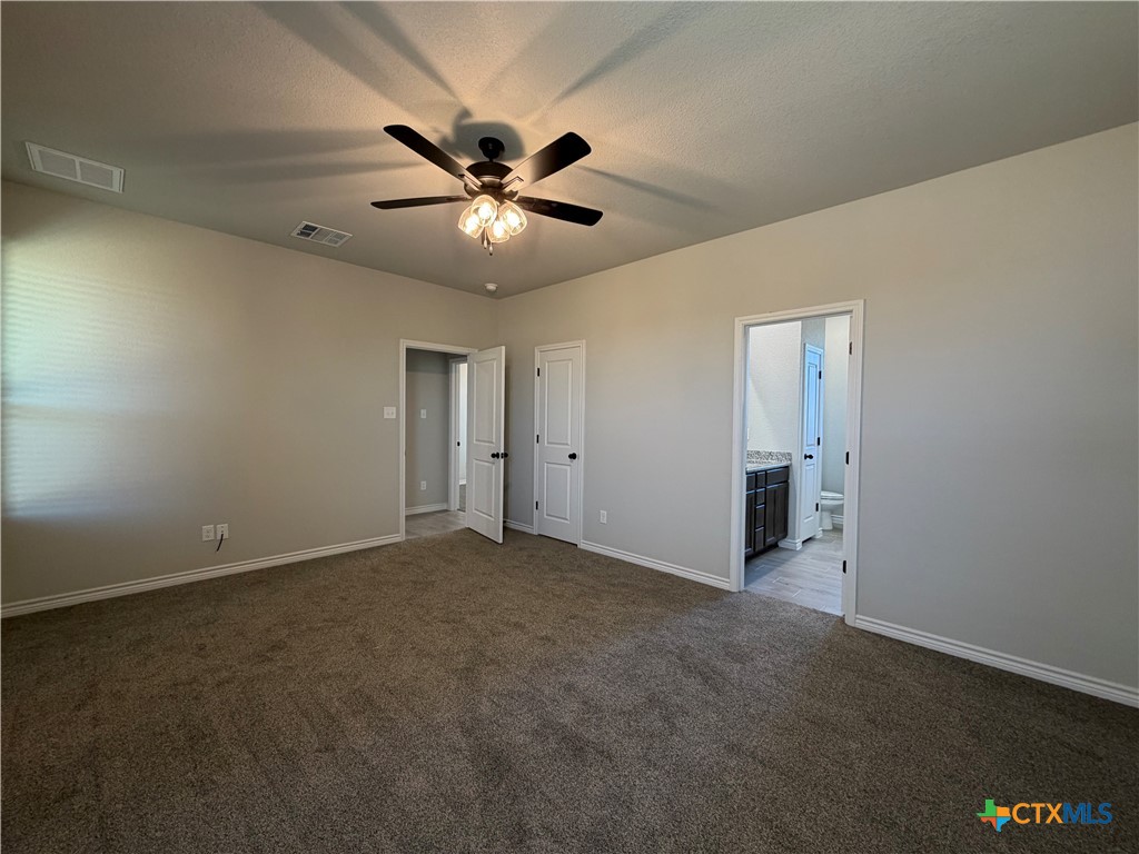 3008 Seeker Street Killeen, TX 76549 - Photo 11 of 25 an empty room with windows and fan