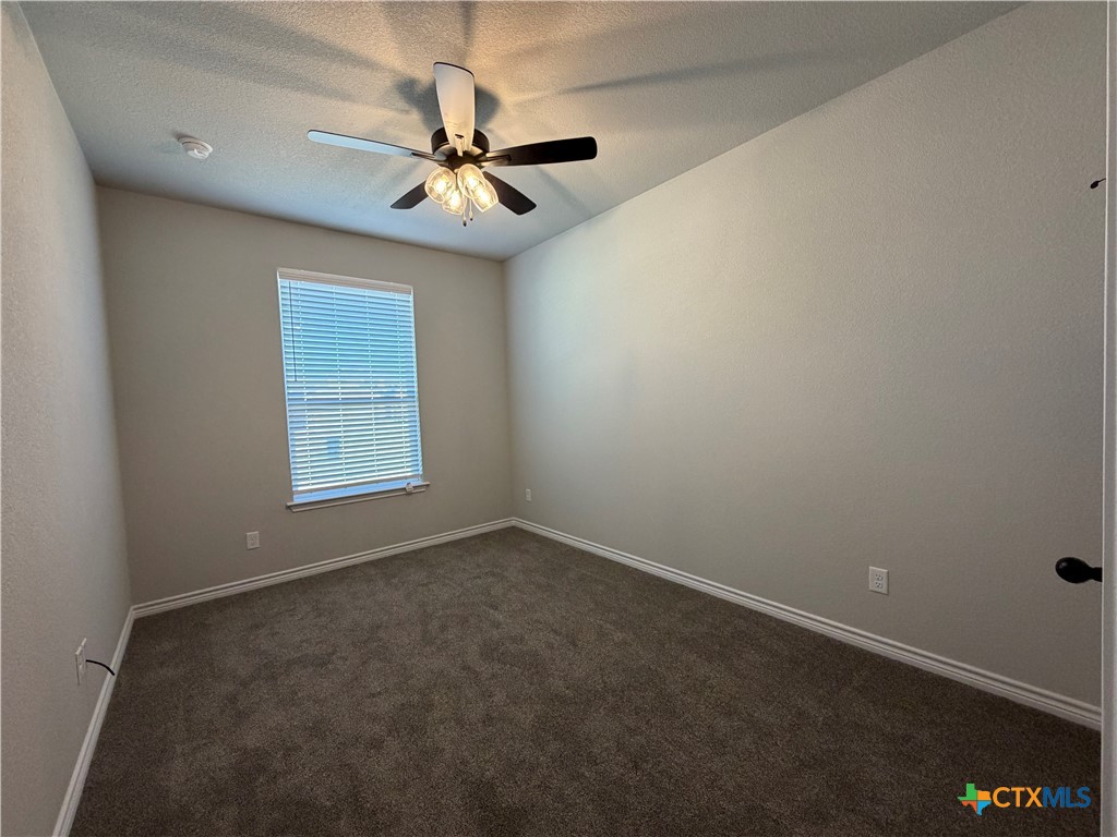 3008 Seeker Street Killeen, TX 76549 - Photo 20 of 25 an empty room with windows and fan