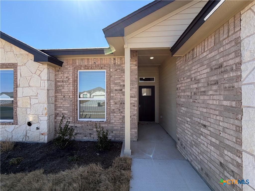3008 Seeker Street Killeen, TX 76549 - Photo 2 of 25 a view of a brick house with a large window